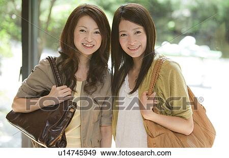 Stock Photo - Two Young Women. Fotosearch
