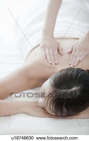 Stock Image - Woman getting a massage, Tokyo Prefecture, Japan. Fotosearch