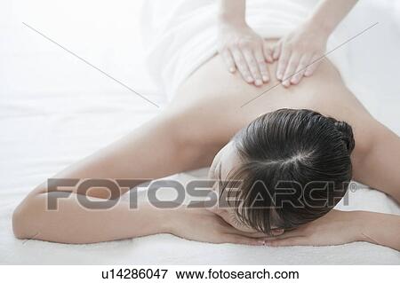 Stock Photo - Woman getting a massage, Tokyo Prefecture, Japan. Fotosearch