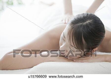 Woman getting a massage, Tokyo Prefecture, Japan View Large Photo Image Stock Photo - Woman getting a massage, Tokyo Prefecture, Japan. Fotosearch