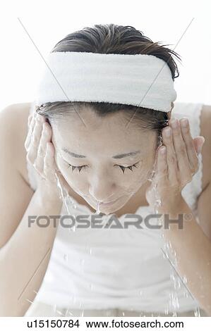 Woman washing her face, Tokyo Prefecture, Japan View Large Photo Image Picture - Woman washing her face, Tokyo Prefecture, Japan. Fotosearch