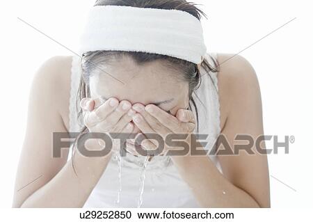 Woman washing her face, Tokyo Prefecture, Japan View Large Photo Image Stock Image - Woman washing her face, Tokyo Prefecture, Japan. Fotosearch