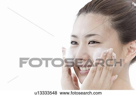 Stock Photo - Woman washing her face, Tokyo Prefecture, Honshu, Japan. Fotosearch