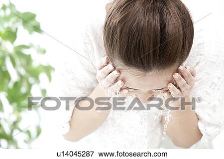 Woman washing her face, Tokyo Prefecture, Honshu, Japan View Large Photo Image Stock Photo - Woman washing her face, Tokyo Prefecture, Honshu, Japan. Fotosearch