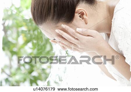 Woman washing her face, Tokyo Prefecture, Honshu, Japan View Large Photo Image Stock Photo - Woman washing her face, Tokyo Prefecture, Honshu, Japan. Fotosearch