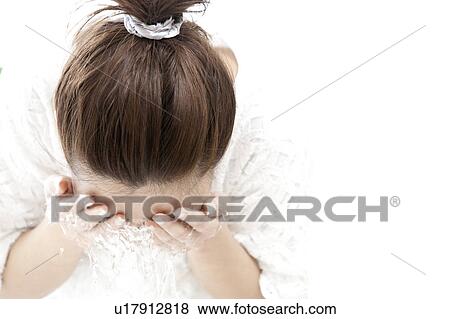 Stock Photo - Woman washing her face, Tokyo Prefecture, Honshu, Japan. Fotosearch