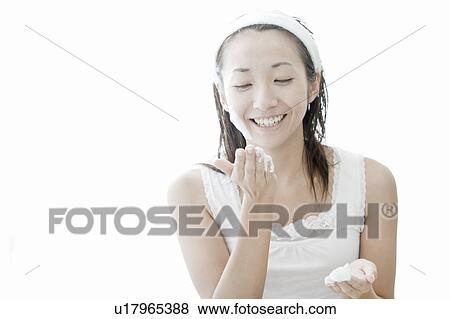 Woman washing her face, Tokyo Prefecture, Japan View Large Photo Image Stock Photo - Woman washing her face, Tokyo Prefecture, Japan. Fotosearch