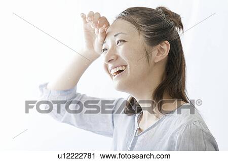 Woman wiping her face with her hand, Tokyo Prefecture, Japan View Large Photo Image Stock Image - Woman wiping her face with her hand, Tokyo Prefecture, Japan. Fotosearch