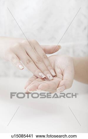 Woman with moisturizer in her hands, Tokyo Prefecture, Honshu, Japan View Large Photo Image Stock Image - Woman with moisturizer in her hands, Tokyo Prefecture, Honshu, Japan. Fotosearch