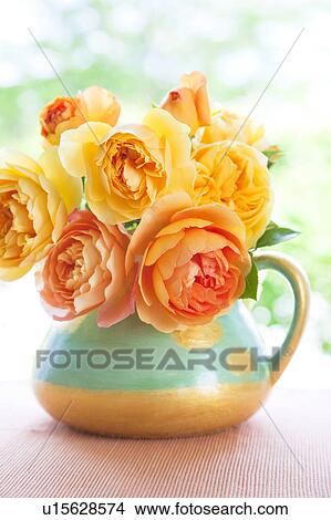 Picture - Yellow and orange roses in a vase. Fotosearch