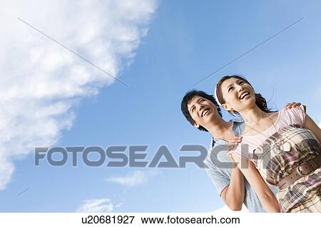 Young Couple Against Sky View Large Photo Image Stock Photo - Young Couple Against Sky. Fotosearch