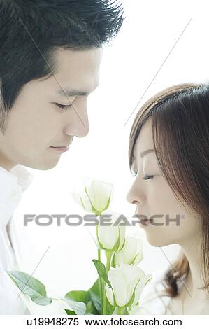 Stock Photography - Young Couple and Roses. Fotosearch