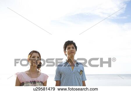 Stock Photo - Young Couple by Sea. Fotosearch