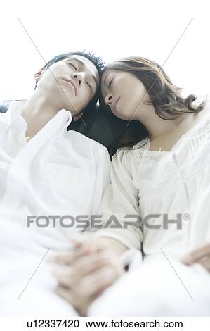 Stock Image - Young Couple Head to Head. Fotosearch