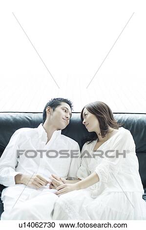 Stock Image - Young Couple Head to Head. Fotosearch