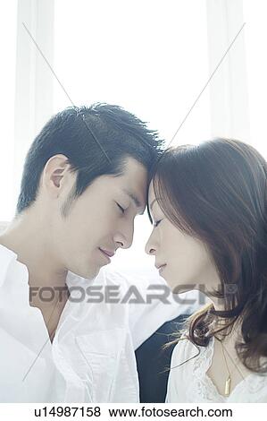 Young Couple Head to Head View Large Photo Image Stock Photo - Young Couple Head to Head. Fotosearch