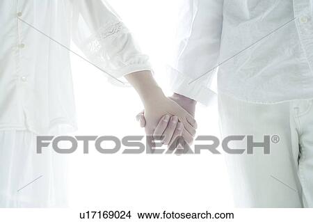 Picture - Young Couple Holding Hands. Fotosearch