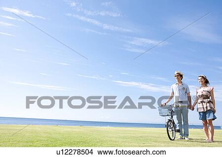 Young Couple on Beach View Large Photo Image Picture - Young Couple on Beach. Fotosearch