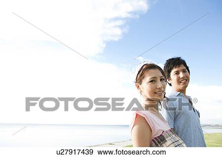 Stock Photo - Young Couple on Beach. Fotosearch