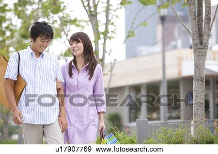 Stock Photo - Young Couple Out Shopping. Fotosearch