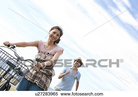 Young Couple with Bicycle View Large Photo Image Stock Photography - Young Couple with Bicycle. Fotosearch