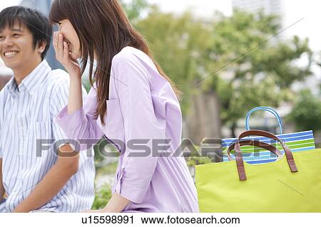 Young Couple with Shopping Bags, Low Angle View View Large Photo Image Stock Image - Young Couple with Shopping Bags, Low Angle View. Fotosearch