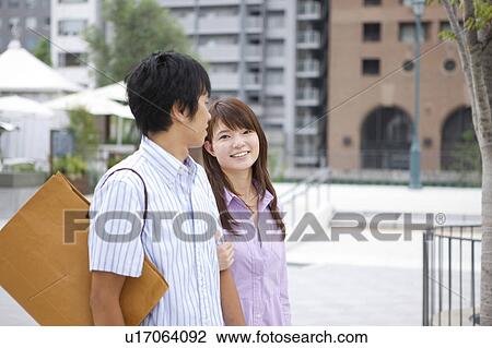 Stock Image - Young Couple with Shopping Bags. Fotosearch