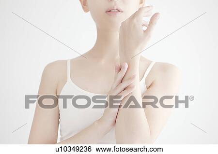 Stock Photograph - Young Woman and Hand Care. Fotosearch