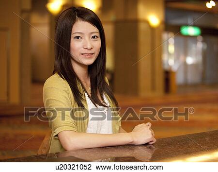 Young Woman at Hotel Reception View Large Photo Image Stock Image - Young Woman at Hotel Reception. Fotosearch