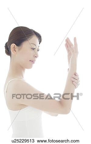 Stock Image - Young Woman Caring For Her Hands. Fotosearch