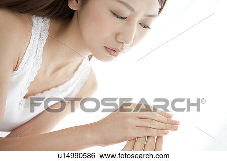 Stock Photograph - Young Woman Caring Her Hands. Fotosearch