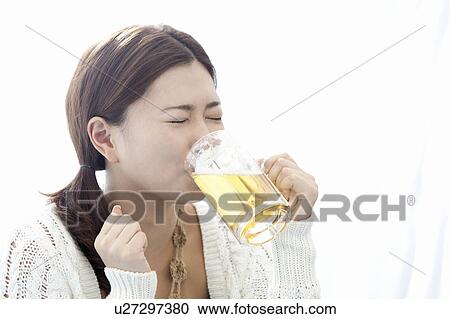 Young woman drinking a glass of beer, Tokyo Prefecture, Honshu, Japan View Large Photo Image Stock Image - Young woman drinking a glass of beer, Tokyo Prefecture, Honshu, Japan. Fotosearch