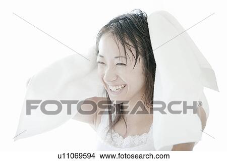 Young woman drying her hair with towel, Tokyo Prefecture, Japan View Large Photo Image Picture - Young woman drying her hair with towel, Tokyo Prefecture, Japan. Fotosearch
