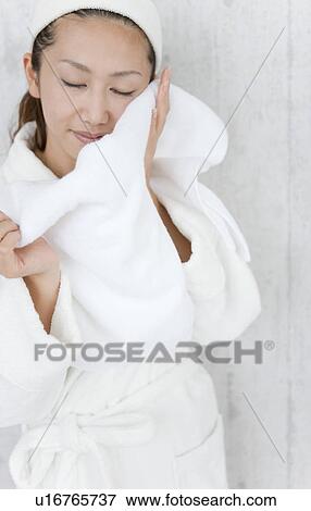 Stock Photo - Young Woman Drying Herself With Towel. Fotosearch