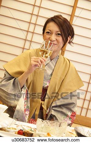 Young Woman Having Dinner and Drinking White Wine View Large Photo Image Stock Image - Young Woman Having Dinner and Drinking White Wine. Fotosearch