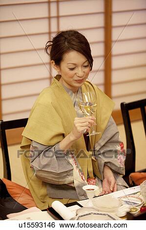 Young Woman Having Dinner and Drinking White Wine View Large Photo Image Stock Photograph - Young Woman Having Dinner and Drinking White Wine. Fotosearch