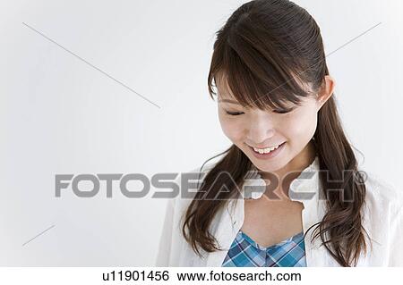 Stock Photograph - Young Woman, High Angle View. Fotosearch