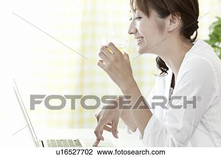 Young woman holding a glass of beer, Tokyo Prefecture, Japan View Large Photo Image Stock Image - Young woman holding a glass of beer, Tokyo Prefecture, Japan. Fotosearch