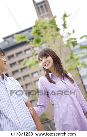 Young Woman Holding Boyfriend's Arm View Large Photo Image Stock Photo - Young Woman Holding Boyfriend's Arm. Fotosearch