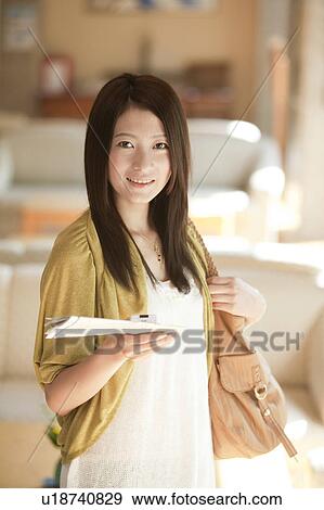 Young Woman Holding Map View Large Photo Image Stock Photo - Young Woman Holding Map. Fotosearch