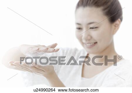 Young woman holding soap suds, Tokyo Prefecture, Honshu, Japan View Large Photo Image Picture - Young woman holding soap suds, Tokyo Prefecture, Honshu, Japan. Fotosearch