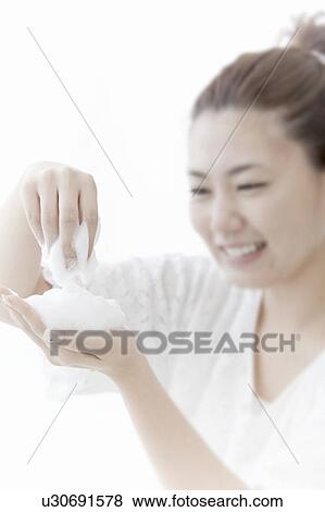 Young woman holding soap suds, Tokyo Prefecture, Honshu, Japan View Large Photo Image Stock Photo - Young woman holding soap suds, Tokyo Prefecture, Honshu, Japan. Fotosearch