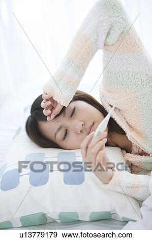 Young Woman Ill with Fever View Large Photo Image Stock Photo - Young Woman Ill with Fever. Fotosearch