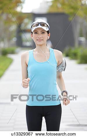 Young Woman Jogging View Large Photo Image Stock Photo - Young Woman Jogging. Fotosearch