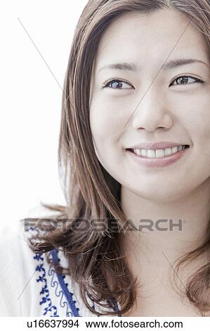 Young woman looking away, Tokyo Prefecture, Honshu, Japan View Large Photo Image Picture - Young woman looking away, Tokyo Prefecture, Honshu, Japan. Fotosearch
