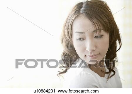 Young woman looking away, Tokyo Prefecture, Japan View Large Photo Image Stock Image - Young woman looking away, Tokyo Prefecture, Japan. Fotosearch