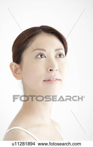Picture - Young Woman Looking Up. Fotosearch