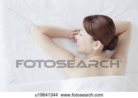 Picture - Young Woman Lying on Front. Fotosearch
