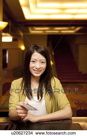 Young Woman Paying For Hotel View Large Photo Image Picture - Young Woman Paying For Hotel. Fotosearch