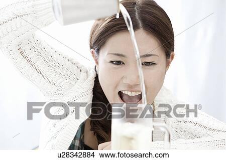 Young woman pouring highball into glass, Tokyo Prefecture, Honshu, Japan View Large Photo Image Picture - Young woman pouring highball into glass, Tokyo Prefecture, Honshu, Japan. Fotosearch